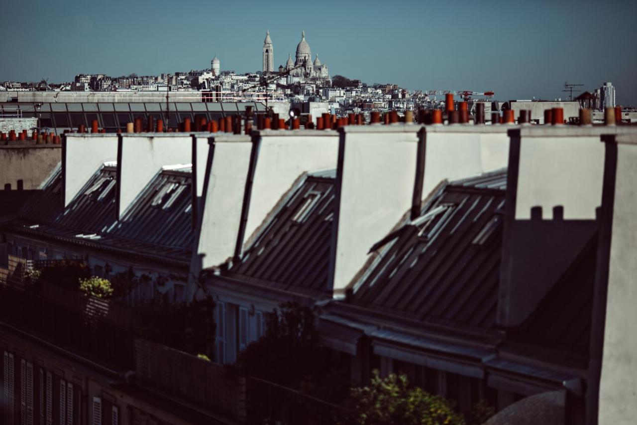 Monsieur George Hotel & Spa - Champs-Elysees Paříž Exteriér fotografie View of the roofs of Paris